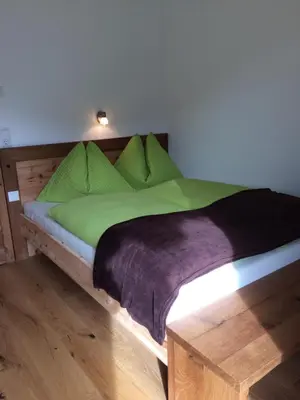 Ein Bett oder Betten in einem Zimmer der Unterkunft Stadtalm Islitzer
