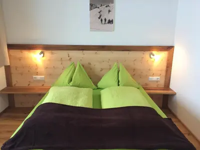 Ein Bett oder Betten in einem Zimmer der Unterkunft Stadtalm Islitzer