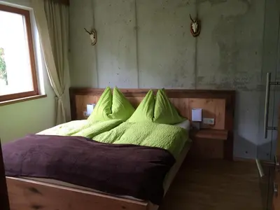 Ein Bett oder Betten in einem Zimmer der Unterkunft Stadtalm Islitzer