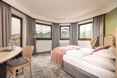 Ein Bett oder Betten in einem Zimmer der Unterkunft Hotel Pirchnerhof