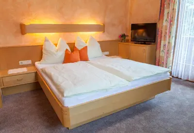 Ein Bett oder Betten in einem Zimmer der Unterkunft Gästehaus Elisabeth