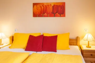 Ein Bett oder Betten in einem Zimmer der Unterkunft Gästehaus Elisabeth