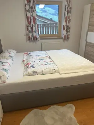 Ein Bett oder Betten in einem Zimmer der Unterkunft Ferienwohnung Eberharter Theresia