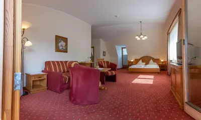 Ein Bett oder Betten in einem Zimmer der Unterkunft Hotel Garni Elisabeth