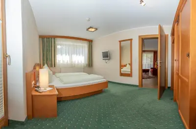 Ein Bett oder Betten in einem Zimmer der Unterkunft Hotel Garni Elisabeth