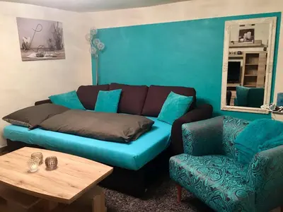 Ein Sitzbereich in der Unterkunft Ferienwohnung Wald