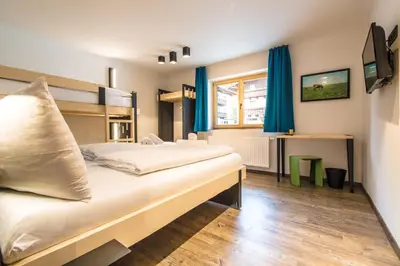Ein Bett oder Betten in einem Zimmer der Unterkunft Blackriver Lodge Saalbach - inkl CrossFit Gym