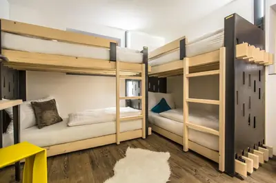 Ein Bett oder Betten in einem Zimmer der Unterkunft Blackriver Lodge Saalbach - inkl CrossFit Gym