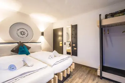 Ein Bett oder Betten in einem Zimmer der Unterkunft Blackriver Lodge Saalbach - inkl CrossFit Gym