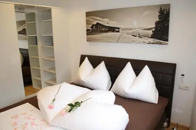 Ein Bett oder Betten in einem Zimmer der Unterkunft Appartements Ski Rent Michael