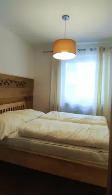 Ein Bett oder Betten in einem Zimmer der Unterkunft Alpenappartements Domicil by Hermann Weiss