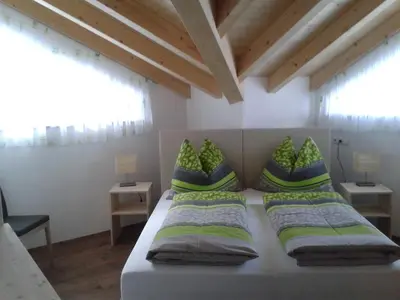 Ein Bett oder Betten in einem Zimmer der Unterkunft Alpenflair