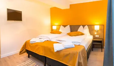 Ein Bett oder Betten in einem Zimmer der Unterkunft Kristall Plaza