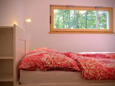 Ein Bett oder Betten in einem Zimmer der Unterkunft Modernes Chalet mit Terrasse und Parkplatz in den Alpen