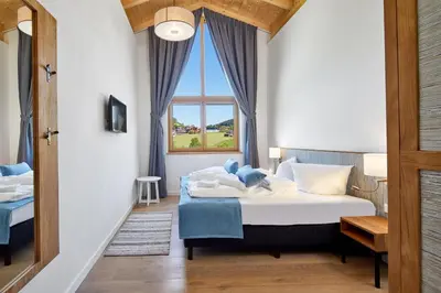 Ein Bett oder Betten in einem Zimmer der Unterkunft Residenz Drachenstein Wildschönau