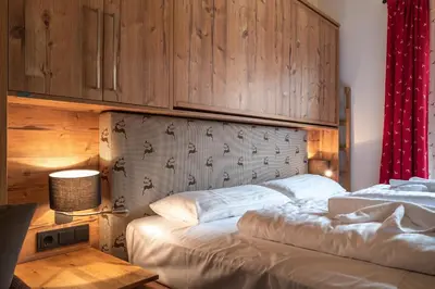 Ein Bett oder Betten in einem Zimmer der Unterkunft Alpin Residenzen Panoramabahn by Alpina-Holiday