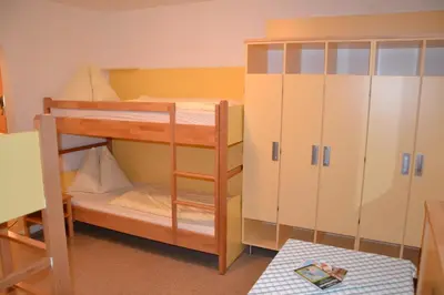 Ein Bett oder Betten in einem Zimmer der Unterkunft Jugendpension Müllauerhof