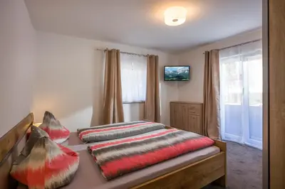 Ein Bett oder Betten in einem Zimmer der Unterkunft Pension Feichter