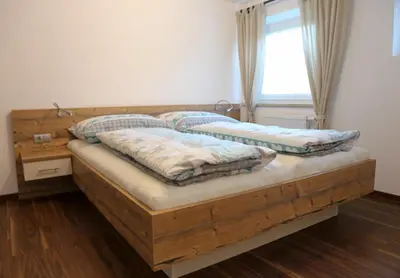 Ein Bett oder Betten in einem Zimmer der Unterkunft Ferienwohnung Köchl