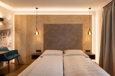 Ein Bett oder Betten in einem Zimmer der Unterkunft Hotel Garni Landhaus Platzer