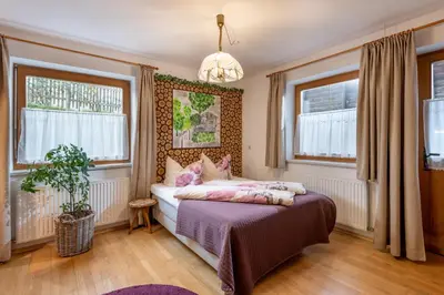 Ein Bett oder Betten in einem Zimmer der Unterkunft Biobauernhof Enting Söll