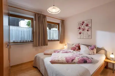 Ein Bett oder Betten in einem Zimmer der Unterkunft Biobauernhof Enting Söll