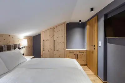 Ein Bett oder Betten in einem Zimmer der Unterkunft Alpbach Lodge Chalet Superior