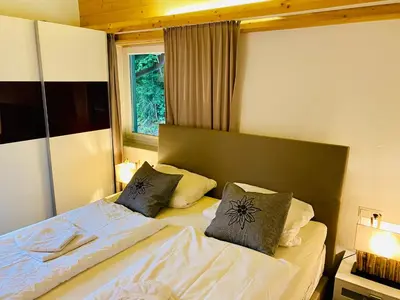 Ein Bett oder Betten in einem Zimmer der Unterkunft Alpensuite TOP 6 am Wilden Kaiser