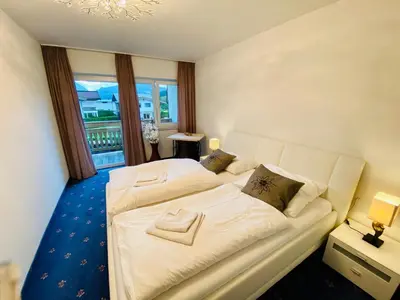 Ein Bett oder Betten in einem Zimmer der Unterkunft Alpensuite TOP 6 am Wilden Kaiser