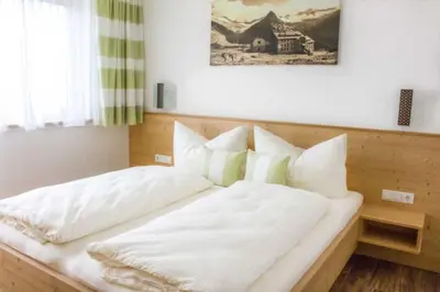 Ein Bett oder Betten in einem Zimmer der Unterkunft Apart Alpin