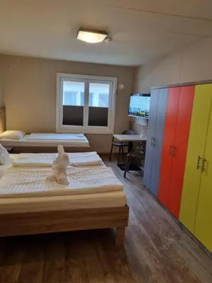 Ein Bett oder Betten in einem Zimmer der Unterkunft Cubo Sport & Art Hotel