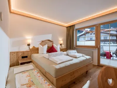 Ein Bett oder Betten in einem Zimmer der Unterkunft Hotel Ritterhof Ellmau