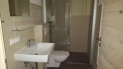 Ein Badezimmer in der Unterkunft Jochberger Dorfstubn