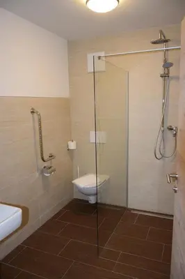 Ein Badezimmer in der Unterkunft Jochberger Dorfstubn