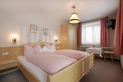 Ein Bett oder Betten in einem Zimmer der Unterkunft Pension Straifhof
