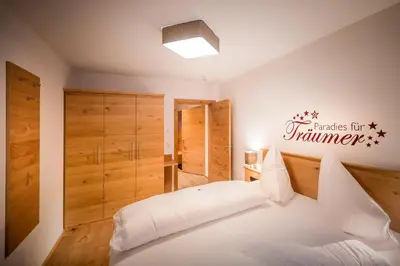 Ein Bett oder Betten in einem Zimmer der Unterkunft Appartements Die Rifflerin