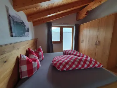 Ein Bett oder Betten in einem Zimmer der Unterkunft Dorfjuwel Alpbachtal