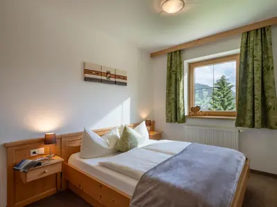 Ein Bett oder Betten in einem Zimmer der Unterkunft Apart Magdalena