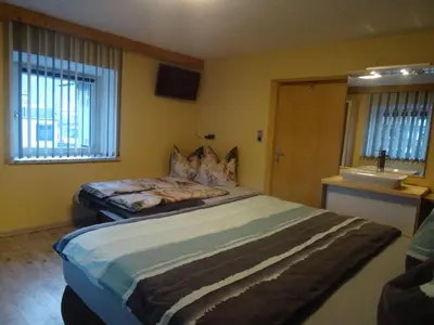 Ein Bett oder Betten in einem Zimmer der Unterkunft Ferienwohnung Gerti