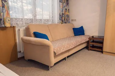 Ein Sitzbereich in der Unterkunft Ferienwohnung Aschenwald