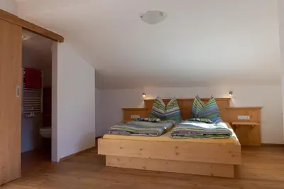Ein Bett oder Betten in einem Zimmer der Unterkunft Hohe Tauernblick