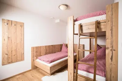 Ein Bett oder Betten in einem Zimmer der Unterkunft Hochmuthhof