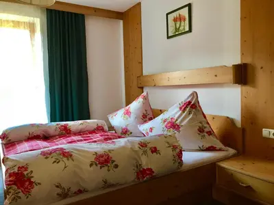Ein Bett oder Betten in einem Zimmer der Unterkunft Ferienwohnungen Luxner