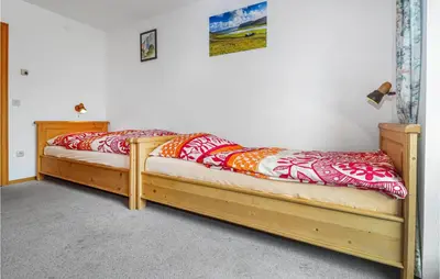 Ein Bett oder Betten in einem Zimmer der Unterkunft Ferienwohnung Nähe Walchsee