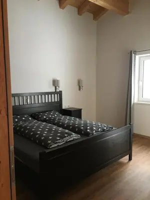 Ein Bett oder Betten in einem Zimmer der Unterkunft Appartement Mühlhäusl