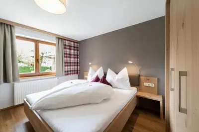 Ein Bett oder Betten in einem Zimmer der Unterkunft Alpapart