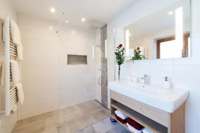 Ein Badezimmer in der Unterkunft Alpapart