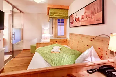 Ein Bett oder Betten in einem Zimmer der Unterkunft Biohotel Castello Königsleiten
