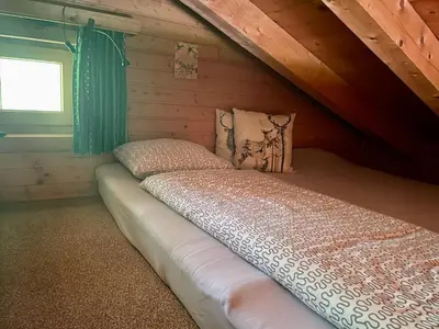 Ein Bett oder Betten in einem Zimmer der Unterkunft Wasserfallhütte Saalbach