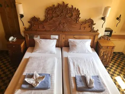 Ein Bett oder Betten in einem Zimmer der Unterkunft Family Hotel Schloss Rosenegg